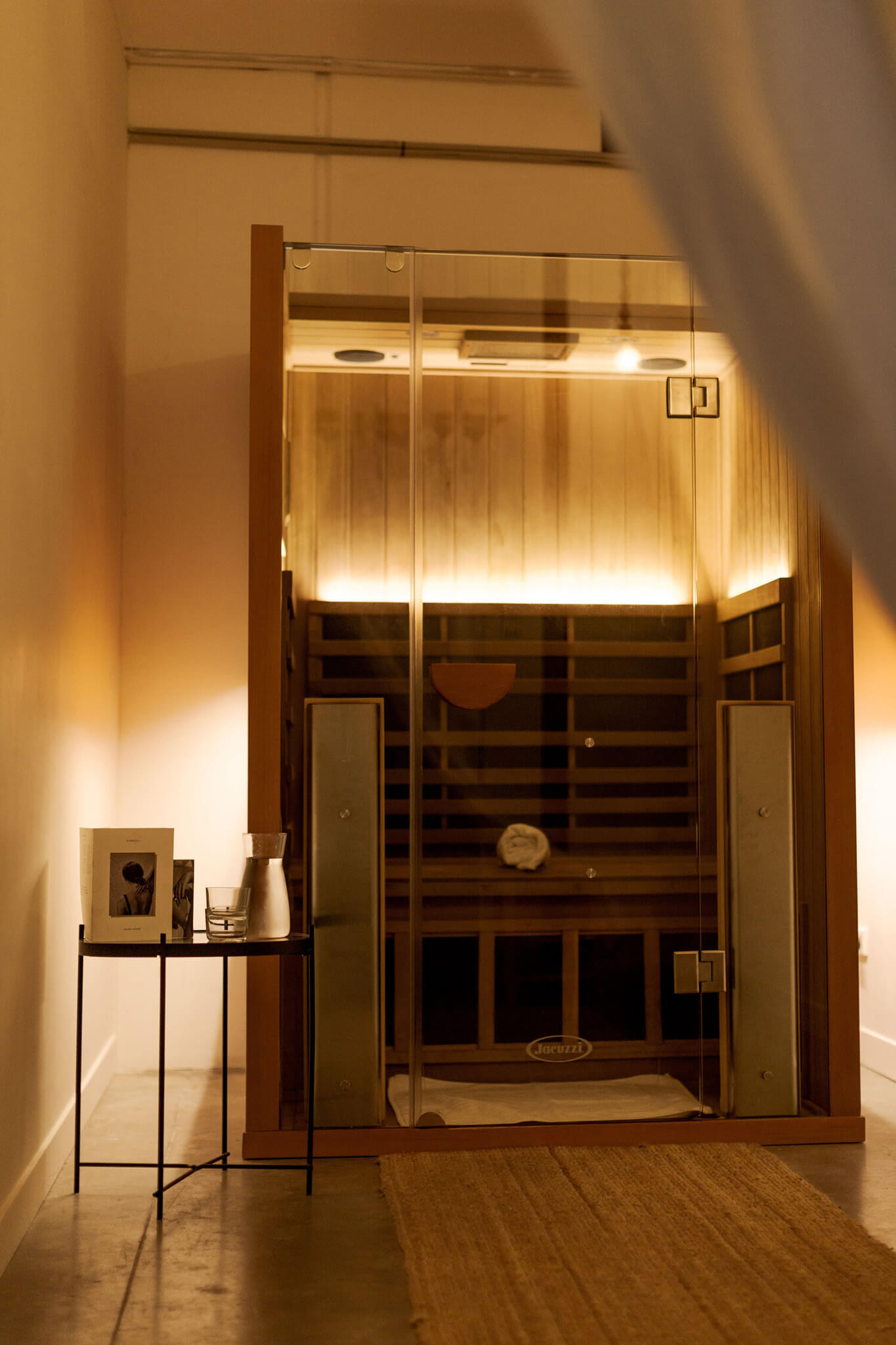 Infrared sauna cabin in a private suite at sundaymood Bangkok, warm interior lighting