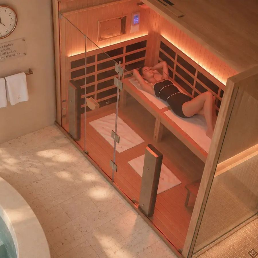 a guest resting in the clearlight full-spectrum infrared sauna in a private sundaymood suite in bangkok